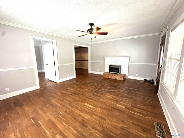 unfurnished living room with ornamental molding, dark hardwood / wood-style floors, a textured ceiling, and a fireplace