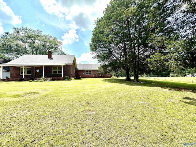 view of yard featuring covered porch