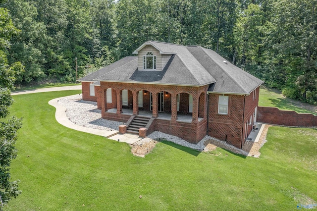 exterior space with a front yard and covered porch