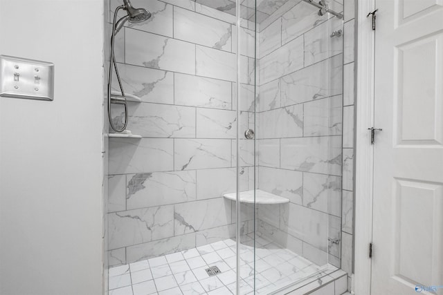 bathroom featuring a shower with door