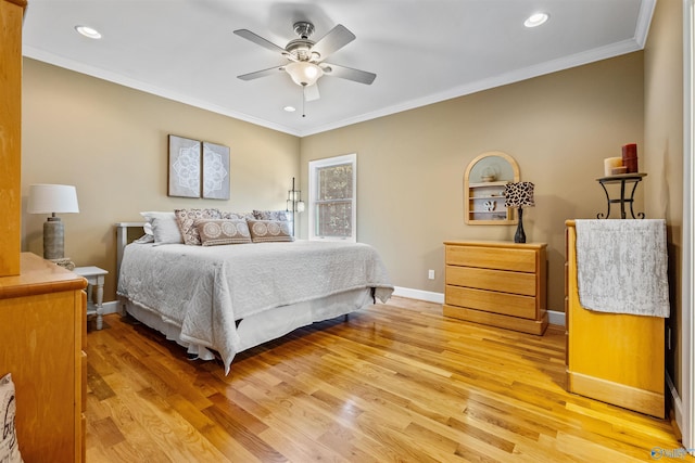 bedroom featuring ceiling fan, crown molding, and light wood-type flooring