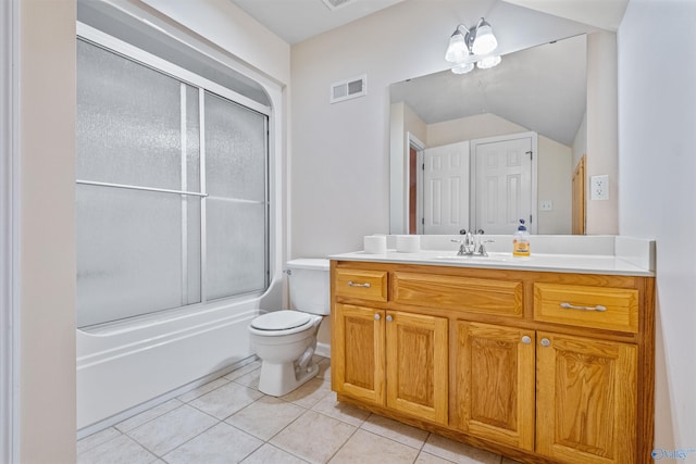 full bathroom featuring vanity, tile patterned flooring, bath / shower combo with glass door, lofted ceiling, and toilet