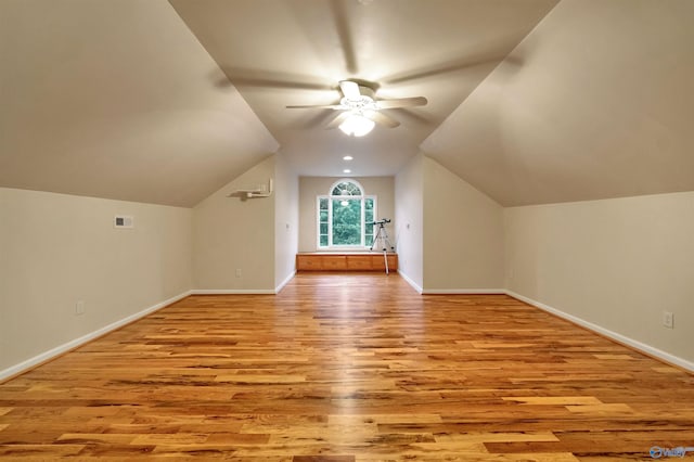 bonus room with ceiling fan, light wood-type flooring, and lofted ceiling