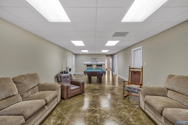 tiled living room with a drop ceiling and billiards