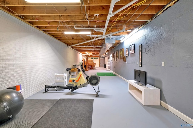 exercise area featuring concrete flooring