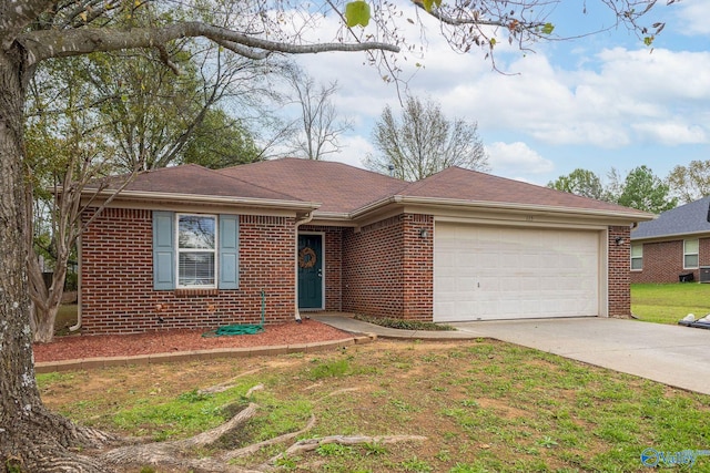 ranch-style home with a garage and a front lawn