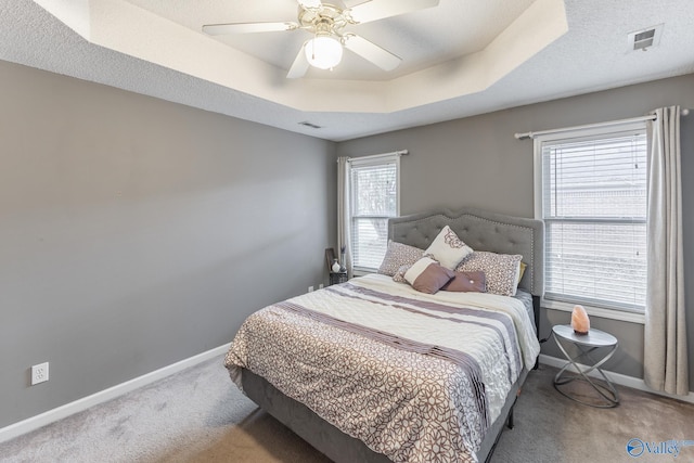 bedroom featuring carpet floors, multiple windows, and ceiling fan