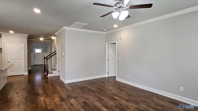 unfurnished room with dark wood-type flooring, visible vents, stairway, and baseboards