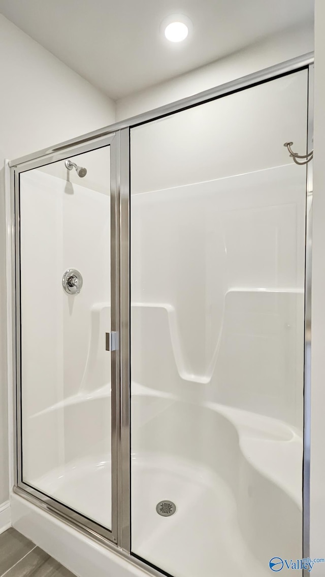 bathroom with a shower stall