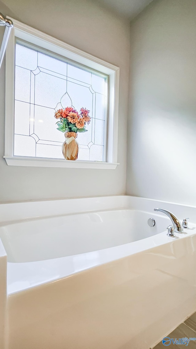 full bathroom with a bath