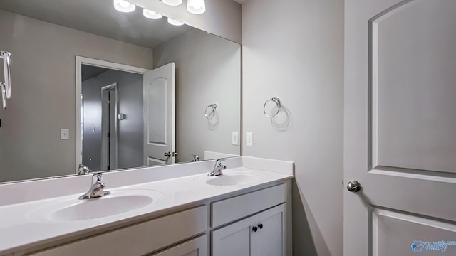 bathroom featuring double vanity and a sink