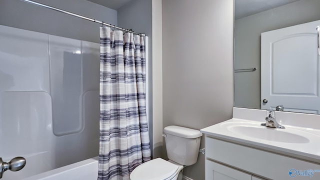 bathroom with toilet, shower / bath combo with shower curtain, and vanity