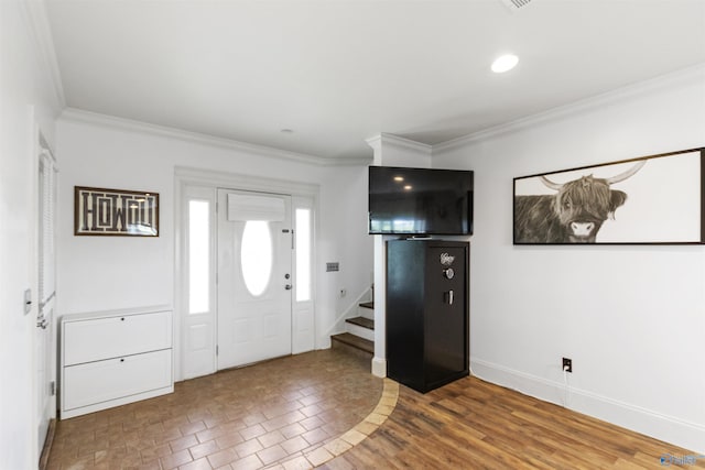 entrance foyer featuring baseboards, stairs, recessed lighting, and crown molding