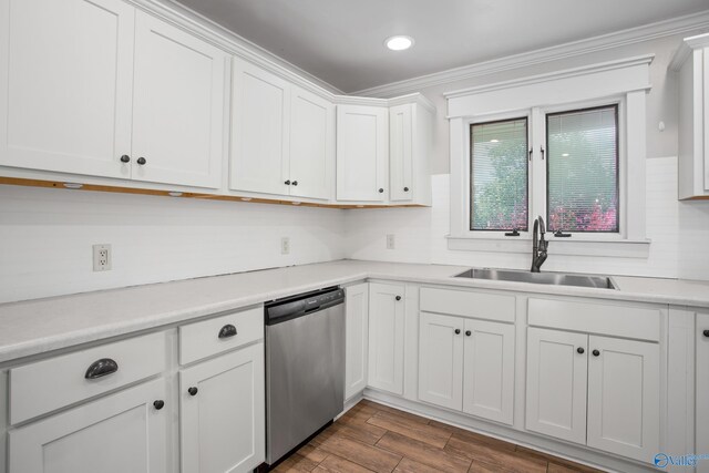 kitchen with white cabinets, sink, dark wood-type flooring, and dishwasher