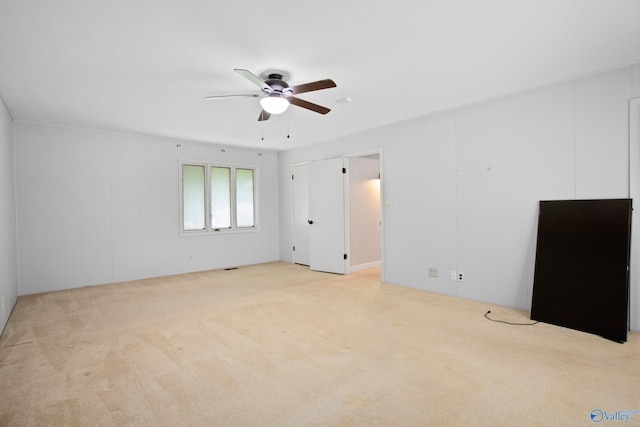 bedroom featuring ceiling fan and light carpet