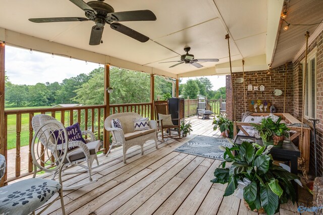 deck with ceiling fan and an outdoor hangout area