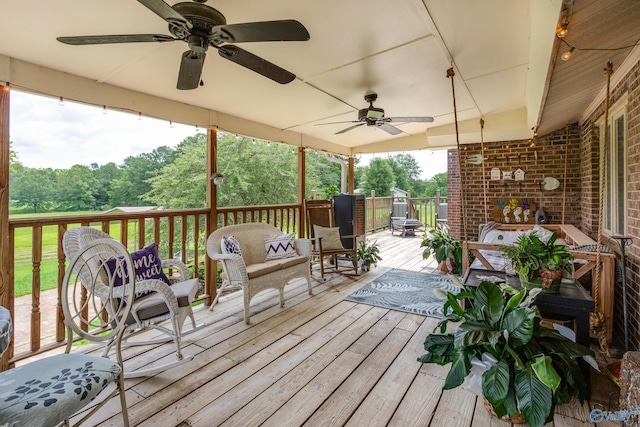 deck featuring ceiling fan and an outdoor hangout area