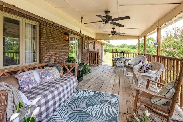 deck with ceiling fan and an outdoor hangout area