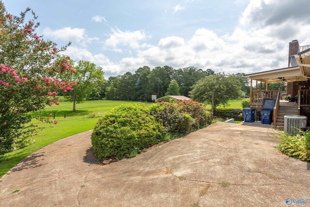 view of patio featuring ceiling fan and central air condition unit