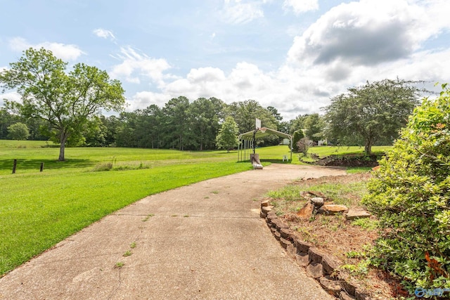 view of property's community with a lawn