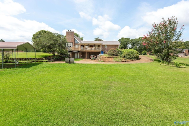 view of yard featuring a wooden deck and a carport