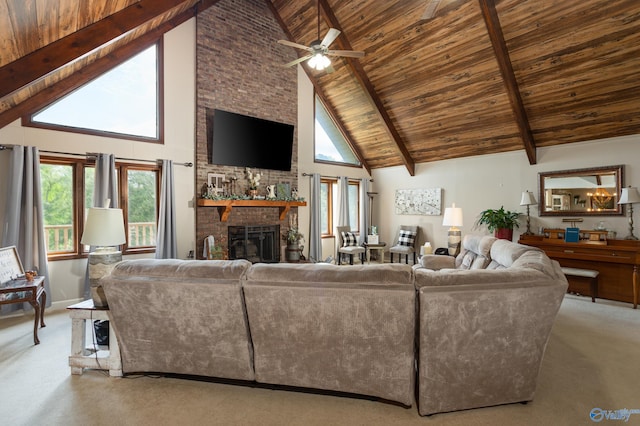 carpeted living room with wooden ceiling, beam ceiling, high vaulted ceiling, and a brick fireplace