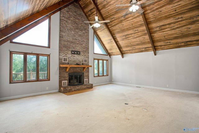 unfurnished living room featuring carpet floors, a brick fireplace, beamed ceiling, and wood ceiling