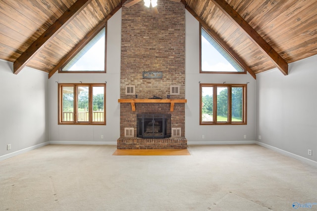 living room with high vaulted ceiling, brick wall, light colored carpet, and a fireplace