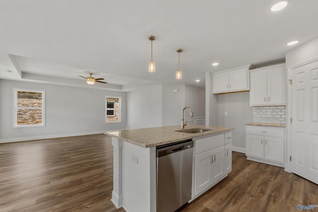 kitchen with white cabinetry, sink, an island with sink, and dishwasher