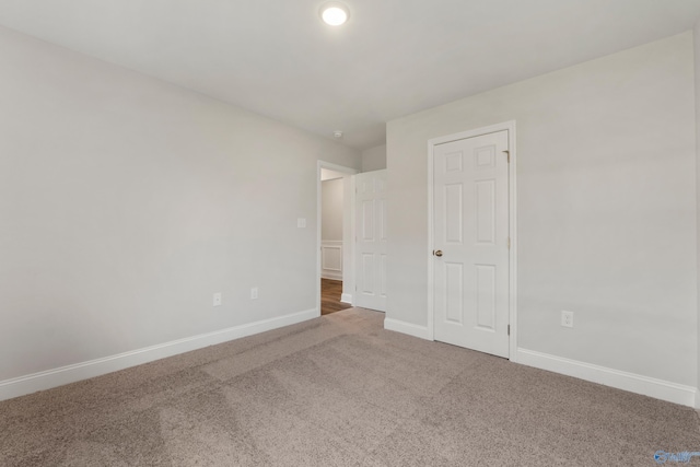 unfurnished bedroom with carpet