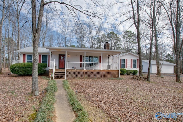 ranch-style house with a garage, an outdoor structure, and a porch