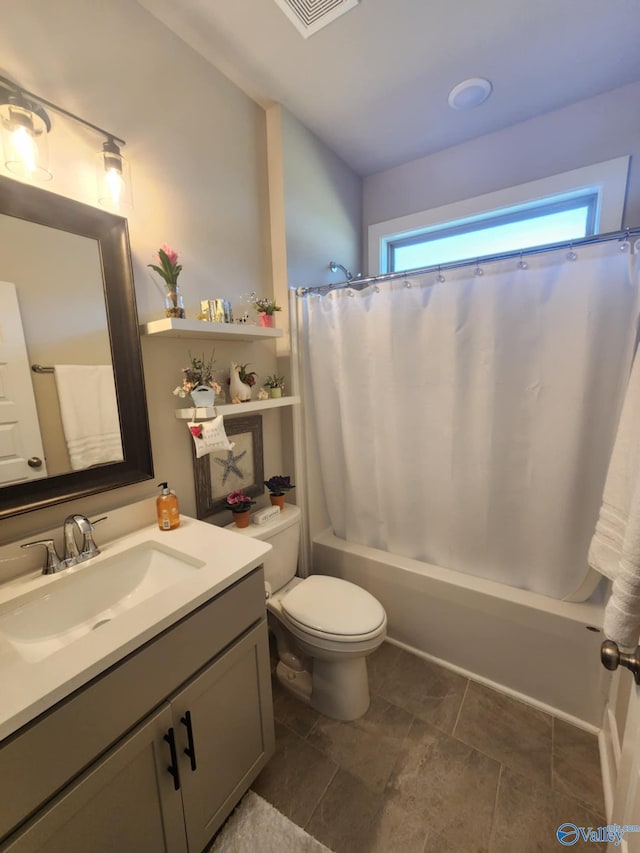 full bathroom featuring vanity, shower / tub combo with curtain, and toilet