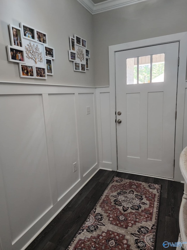 doorway with dark wood-type flooring and crown molding