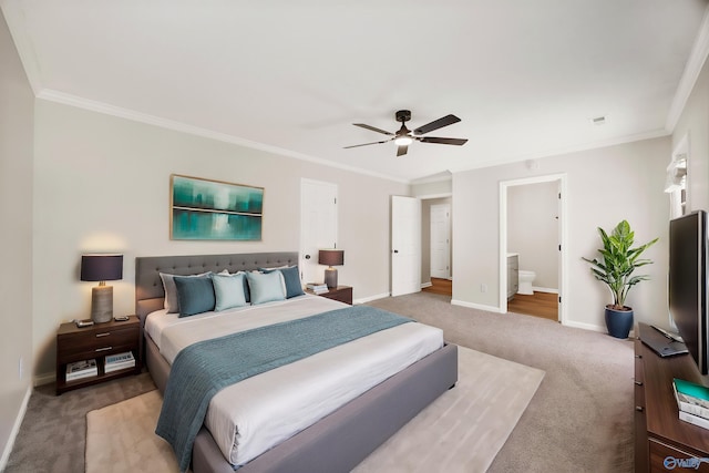1417 Smith Ave SW, Decatur, AL 35603 - bedroom with carpet floors, crown molding, baseboards, a ceiling fan, and connected bathroom
