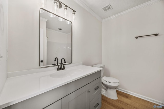 1417 Smith Ave SW, Decatur, AL 35603 - bathroom with crown molding, wood finished floors, toilet, vanity, and a shower