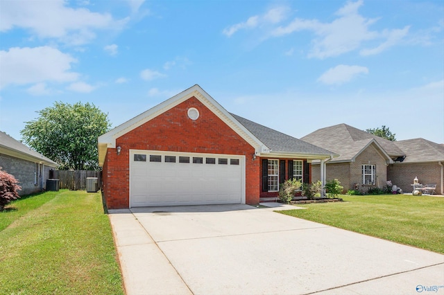 1417 Smith Ave SW, Decatur, AL 35603 - view of front of home featuring brick siding, cooling unit, and a garage
