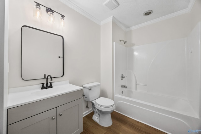 1417 Smith Ave SW, Decatur, AL 35603 - bathroom featuring crown molding, toilet, wood finished floors, vanity, and shower / washtub combination