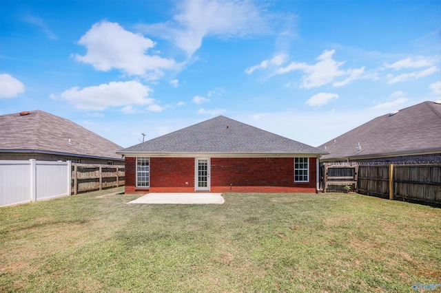 1417 Smith Ave SW, Decatur, AL 35603 - back of house with a patio area, brick siding, and a shingled roof