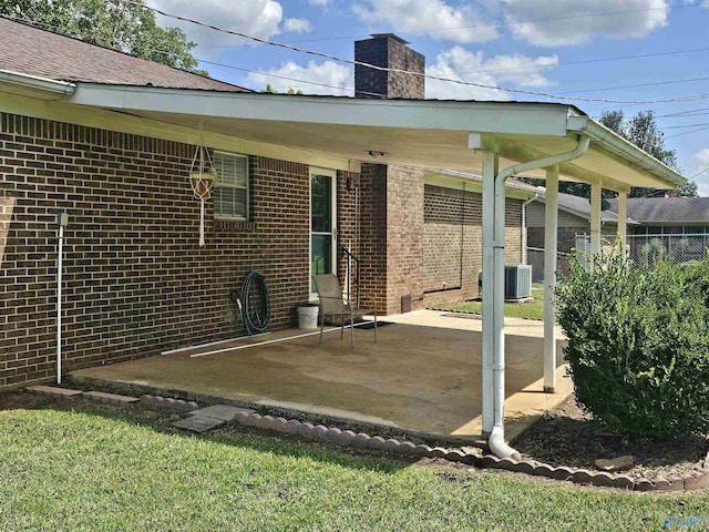 back of property with a patio