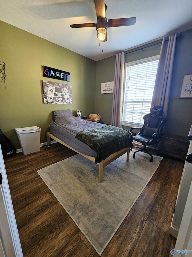 bedroom with wood finished floors and ceiling fan
