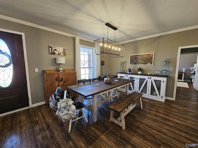 dining area featuring a chandelier, wood finished floors, crown molding, and baseboards