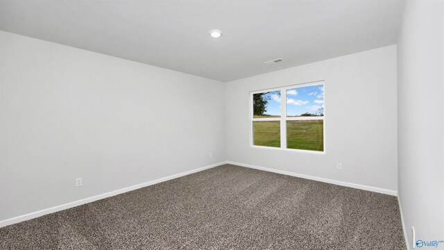 empty room with carpet flooring