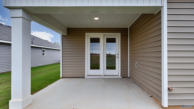 doorway to property with a patio area