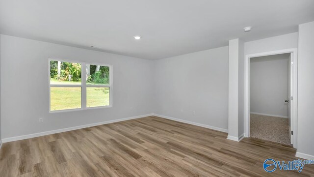 spare room with light hardwood / wood-style floors