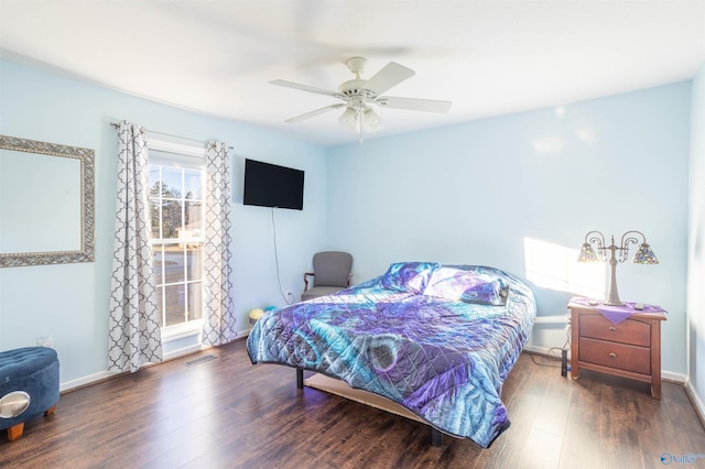 bedroom with dark wood-type flooring and ceiling fan