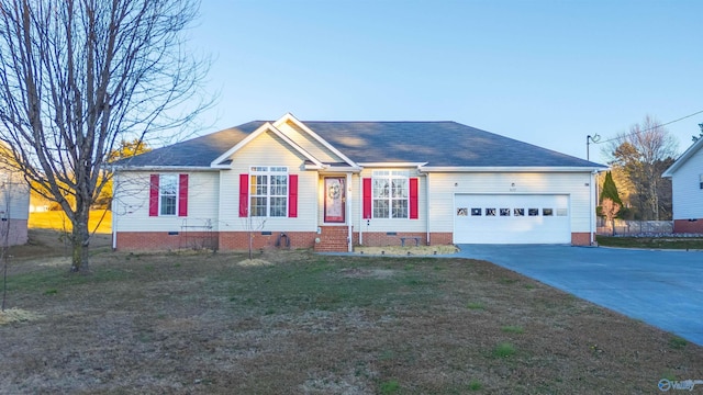 single story home featuring a garage and a front lawn