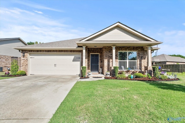 view of front of property with brick siding, driveway, an attached garage, and covered porch