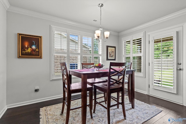 dining area with a chandelier, crown molding, dark wood-style floors, and baseboards