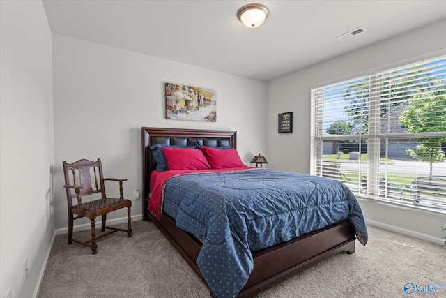 bedroom featuring carpet floors and baseboards