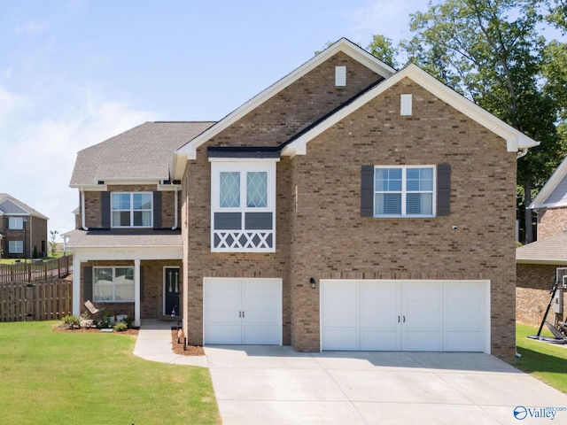 view of front facade featuring a garage and a front yard